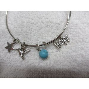 SILVER CHARM BRACELET WITH 4 CHARMS OF A STAR HUMMINGBIRD BLUE BALL HOPE